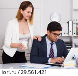 Sexual harassment between colleagues. Стоковое фото, фотограф Яков Филимонов / Фотобанк Лори