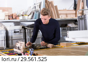 Young man working on architectural model. Стоковое фото, фотограф Яков Филимонов / Фотобанк Лори