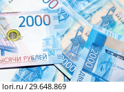 Новые купюры номиналом 2000 рублей крупным планом, фон. Стоковое фото, фотограф Елена Коромыслова / Фотобанк Лори