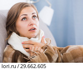 Sick girl with scarf on neck. Стоковое фото, фотограф Яков Филимонов / Фотобанк Лори