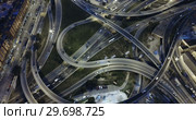 Aerial view of lighted highway road junctions at night. Стоковое видео, видеограф Яков Филимонов / Фотобанк Лори