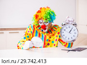 Male clown preparing for perfomance at home. Стоковое фото, фотограф Elnur / Фотобанк Лори