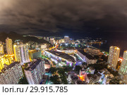 China, Hainan Island, Dadonghai Bay - December 1, 2018: Night view of Dadonghai Bay, "Winter and Summer" shopping center, editoria. Стоковое фото, фотограф Evgenii Mitroshin / Фотобанк Лори