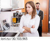 Upset girl with husband in kitchen furniture salon. Стоковое фото, фотограф Яков Филимонов / Фотобанк Лори