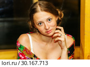 Portrait of a fair-haired smiling girl. A close-up portrait of a horizontal format, made in the evening in a summer terrace with artificial lighting. Стоковое фото, фотограф Вадим Орлов / Фотобанк Лори