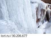 Frozen ice on rocks from a waterfall in the mountains. Стоковое фото, фотограф Restyler Viacheslav / Фотобанк Лори