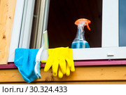 window cleaning tools on window sill close up. Стоковое фото, фотограф Константин Лабунский / Фотобанк Лори