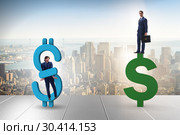 Businessman in dollar and debt concept. Стоковое фото, фотограф Elnur / Фотобанк Лори