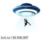 Flying saucer abducting young businessman. Стоковое фото, фотограф Elnur / Фотобанк Лори