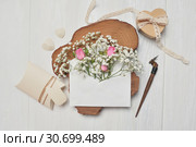 Calligraphic feather an envelope with flowers and a letter, heart gift box, greeting card for Valentines Day with place for your text. Flat lay, top view photo mock up. Стоковое фото, фотограф Happy Letters / Фотобанк Лори