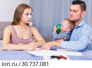Gloomy female signing documents. Стоковое фото, фотограф Яков Филимонов / Фотобанк Лори
