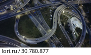 Aerial view of lighted highway road junctions at night. Стоковое видео, видеограф Яков Филимонов / Фотобанк Лори
