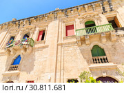 beautiful baroque building with bright doors and shutters built with sandstone (2019 год). Стоковое фото, фотограф Ирина Мойсеева / Фотобанк Лори