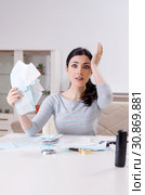 Young woman in budget planning concept. Стоковое фото, фотограф Elnur / Фотобанк Лори