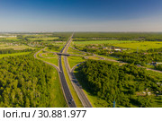 Aerial view at junctions of rural highway. Vehicles drive on roads, Moscow area, Russia. Стоковое фото, фотограф Кирилл Трифонов / Фотобанк Лори