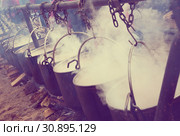 Iron cauldrons for cooking in open fire. Стоковое фото, фотограф Яков Филимонов / Фотобанк Лори