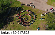 Russia - Tatarstan 25-05-2019: People in traditional Russian clothes lead the dance between the trees. Редакционное видео, видеограф Константин Шишкин / Фотобанк Лори