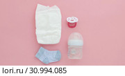 Set for a newborn nipple bottle diaper socks. Стоковое видео, видеограф Ekaterina Demidova / Фотобанк Лори