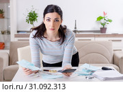 Young woman in budget planning concept. Стоковое фото, фотограф Elnur / Фотобанк Лори