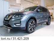 SANKT-PETRBURG, RUSSIA - JULY 03, 2019: New Nissan X-Trayl (2019) in car showroom close up. Редакционное фото, фотограф Виктор Карасев / Фотобанк Лори