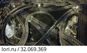 Aerial view of lighted highway road junctions at night. Стоковое видео, видеограф Яков Филимонов / Фотобанк Лори