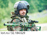 Military soldier portrait with machine gun and protective clothing. Стоковое фото, фотограф Дмитрий Калиновский / Фотобанк Лори