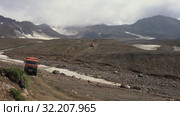 Russian off-road extreme expedition truck KamAZ driving on mountain road (2019 год). Редакционное видео, видеограф А. А. Пирагис / Фотобанк Лори