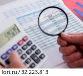 Finance analyst looking and financial reports. Стоковое фото, фотограф Elnur / Фотобанк Лори