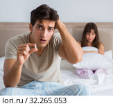 Man suffering from impotency with pill. Стоковое фото, фотограф Elnur / Фотобанк Лори