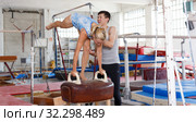 Couple train elements on pommel horse. Стоковое фото, фотограф Яков Филимонов / Фотобанк Лори