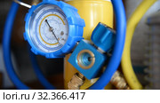 HVAC Repair Close-Up Vacuum pump, pressure gauge, manifold for Repair and Installation of refrigerators, air conditioners, ventilation, heating. Стоковое видео, видеограф Mikhail Erguine / Фотобанк Лори