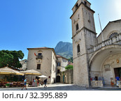 Kotor, Montenegro - June 10. 2019. Clock Tower at St. Tryphon Cathedral in Old Town. Редакционное фото, фотограф Володина Ольга / Фотобанк Лори