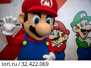 Стенд персонажей видеоигр компании Nintendo Марио и Луиджи на выставке «ИгроМир» и Comic Con Russia в городе Москве, Россия (2019 год). Редакционное фото, фотограф Николай Винокуров / Фотобанк Лори