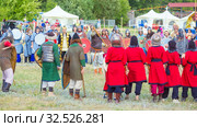 Russia, Samara, July 2019: an ethno-historical holiday with a reconstruction of the battle of Timur and Tokhtamysh in 1391. The participants of the festival. Khan surrounded by suites. Редакционное фото, фотограф Акиньшин Владимир / Фотобанк Лори