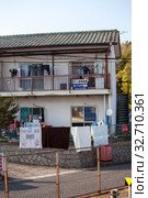 Low-rise apartment buildings are on outskirt streets of town. Modern small and tight houses for people living. Houses are built extremely close to railway (2013 год). Редакционное фото, фотограф Кекяляйнен Андрей / Фотобанк Лори