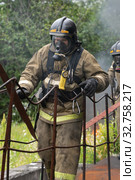 Firefighters of Fire Department Federal Fire Service during fire extinguishing, training to overcome fire zone of psychological training for firefighters (2019 год). Редакционное фото, фотограф А. А. Пирагис / Фотобанк Лори