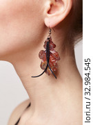 Beautiful woman with galvanic earring in form of oak leaf. Стоковое фото, фотограф Сергей Пристяжнюк (Serg Zastavkin) / Фотобанк Лори