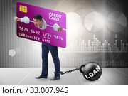 Businessman in credit card burden concept in pillory. Стоковое фото, фотограф Elnur / Фотобанк Лори