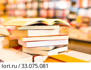 stack of books lying on table in bookstore. Стоковое фото, фотограф Татьяна Яцевич / Фотобанк Лори