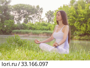 Yoga Woman Meditating Relaxing Healthy Lifestyle. Стоковое фото, фотограф Mitar gavric / PantherMedia / Фотобанк Лори