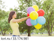 Happy Young Woman With Colorful Balloons. Стоковое фото, фотограф Mitar gavric / PantherMedia / Фотобанк Лори