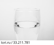 Black and white Glass of water. Стоковое фото, фотограф Claudio Divizia / Smarterpix / Фотобанк Лори