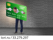 Businessman in credit card burden concept in pillory. Стоковое фото, фотограф Elnur / Фотобанк Лори