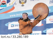 Male dancer in national clothes aboriginal people expression dancing with tambourine. Concert Koryak Dance Ensemble Mengo (2019 год). Редакционное фото, фотограф А. А. Пирагис / Фотобанк Лори
