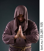 Monk in religious concept on gray background. Стоковое фото, фотограф Elnur / Фотобанк Лори