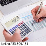 Finance analyst looking and financial reports. Стоковое фото, фотограф Elnur / Фотобанк Лори