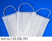 Antiviral mask on blue background. Protective masks. Стоковое фото, фотограф Попова Ольга / Фотобанк Лори