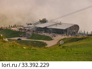MALCESINE, ITALY - AUGUST 09, 2019: View of the cable station with a queue for the cable car on Monte Baldo in Italy. Стоковое фото, фотограф Irina Kuchugurina/Gaudy / Фотобанк Лори