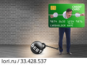 Businessman in credit card burden concept in pillory. Стоковое фото, фотограф Elnur / Фотобанк Лори