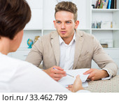 manager suggests elderly lady two-way deal. Стоковое фото, фотограф Яков Филимонов / Фотобанк Лори